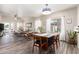 Inviting living space with wood flooring, abundant natural light, and view of the outdoor pool area at 318 E Taylor Trl, San Tan Valley, AZ 85143