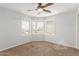 Bedroom with three windows allowing ample natural light in a carpeted room at 3413 E Equestrian Trl, Phoenix, AZ 85044