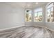 Bright bedroom with new flooring, trim, and large windows at 3413 E Equestrian Trl, Phoenix, AZ 85044