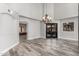 Dining room with chandelier, door to outdoor living space, and hard surface flooring at 3413 E Equestrian Trl, Phoenix, AZ 85044