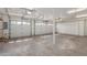Spacious garage with multiple car parking, storage and bright lighting at 3413 E Equestrian Trl, Phoenix, AZ 85044