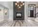 Open concept living room with fireplace, chandelier, and tile flooring at 3413 E Equestrian Trl, Phoenix, AZ 85044