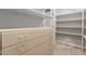 Spacious walk-in pantry with plenty of shelving and drawer space for organized storage at 3413 E Equestrian Trl, Phoenix, AZ 85044