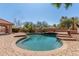 Backyard oasis with a private pool and lush desert landscaping, perfect for outdoor enjoyment at 3413 E Equestrian Trl, Phoenix, AZ 85044