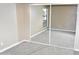 This carpeted bedroom showcases sliding mirrored closet doors and a window at 3420 W Danbury Dr # C130, Phoenix, AZ 85053