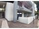 Exterior view of a two-story condo unit with a private patio, balcony, and dedicated parking at 3420 W Danbury Dr # C130, Phoenix, AZ 85053