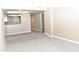 Spacious living room with carpeted floors is conveniently open to the kitchen at 3420 W Danbury Dr # C130, Phoenix, AZ 85053