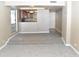Spacious living room with carpeted floors is conveniently open to the kitchen at 3420 W Danbury Dr # C130, Phoenix, AZ 85053