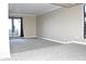 Spacious living room has carpeted floors, large windows, and base molding at 3420 W Danbury Dr # C130, Phoenix, AZ 85053