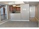 Open-concept living room with a combined kitchen and plenty of natural light at 3420 W Danbury Dr # C130, Phoenix, AZ 85053