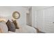 Bright and airy bedroom with a closet, neutral tones, and a decorative mirror at 35545 N Breezy Ln, San Tan Valley, AZ 85140