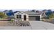 Charming single story home showcasing desert landscaping and a two car garage at 35545 N Breezy Ln, San Tan Valley, AZ 85140
