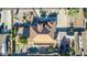 Expansive aerial view of the home showcasing the pool, lush landscaping, and RV parking, offering a private oasis at 35662 N Creekside Ln, Queen Creek, AZ 85144