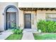 Inviting townhome entrance featuring decorative security doors, lush greenery, and clear unit numbers at 3820 N 30Th St, Phoenix, AZ 85016