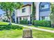 Townhome showcases vibrant green lawn, lush hedges, and charming architectural details at 3820 N 30Th St, Phoenix, AZ 85016