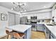 Modern kitchen featuring stainless steel appliances, white and gray cabinets, and a kitchen island at 3820 N 30Th St, Phoenix, AZ 85016