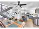 Open-concept living area features modern decor, a staircase, and a stylish kitchen at 3820 N 30Th St, Phoenix, AZ 85016