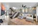 Stylish living room featuring an open staircase, modern decor, and hardwood floors throughout the home at 3820 N 30Th St, Phoenix, AZ 85016