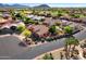 Expansive aerial shot showcasing the neighborhood's well-manicured lawns, desert landscaping, and peaceful cul-de-sac at 4055 N Recker Rd # 71, Mesa, AZ 85215