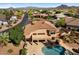 Aerial of backyard featuring a refreshing pool, outdoor living space, well-manicured landscaping, and mountain views at 4055 N Recker Rd # 71, Mesa, AZ 85215