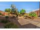 Serene backyard with lush landscaping and stone pathways at 4055 N Recker Rd # 71, Mesa, AZ 85215
