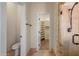 Bright bathroom shows toilet, travertine shower and walk-in closet for this house at 4055 N Recker Rd # 71, Mesa, AZ 85215