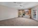 Carpeted bedroom with view of the outdoor pool area at 4055 N Recker Rd # 71, Mesa, AZ 85215