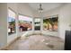 Sunlit breakfast nook surrounded by large windows showcasing the backyard and desert landscaping at 4055 N Recker Rd # 71, Mesa, AZ 85215