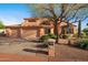 Charming two-story home featuring a three-car garage and mature desert landscaping at 4055 N Recker Rd # 71, Mesa, AZ 85215