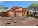 Beautiful two-story home showcasing a three-car garage and desert landscaping at 4055 N Recker Rd # 71, Mesa, AZ 85215