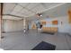 Spacious garage with ample storage cabinets along the back and side walls, with bright overhead lighting at 4055 N Recker Rd # 71, Mesa, AZ 85215
