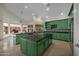 Bright kitchen with ample counter space and green cabinets at 4055 N Recker Rd # 71, Mesa, AZ 85215