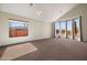 Sunny living room with large windows and plush carpeting at 4055 N Recker Rd # 71, Mesa, AZ 85215