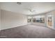 Spacious living room with natural light and access to a balcony at 4055 N Recker Rd # 71, Mesa, AZ 85215