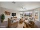 Bright living room with plush seating, modern ceiling fan, and large windows for natural light at 4055 N Recker Rd # 71, Mesa, AZ 85215