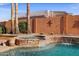Sparkling pool and spa with stone accents and privacy wall at 4055 N Recker Rd # 71, Mesa, AZ 85215