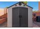 Durable outdoor storage shed with double doors, offering convenient space for storing tools and equipment at 4055 N Recker Rd # 71, Mesa, AZ 85215