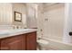 Bathroom featuring tub with tiled surround, updated vanity, and neutral tones at 42145 N Fairgreen Ct, Anthem, AZ 85086