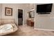 Upscale bathroom with soaking tub, vanity, walk-in closet, and mounted television at 42145 N Fairgreen Ct, Anthem, AZ 85086