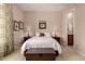 Bedroom with neutral-toned decor with views to the ensuite bathroom at 42145 N Fairgreen Ct, Anthem, AZ 85086
