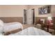 Bedroom featuring twin beds, carpeted floors, and multiple doorways at 42145 N Fairgreen Ct, Anthem, AZ 85086