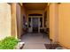 Inviting entryway with a decorative wood door, elegant lighting, and stylish decor at 42145 N Fairgreen Ct, Anthem, AZ 85086
