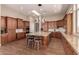 Spacious kitchen features custom cabinetry, a large island, and modern stainless steel appliances at 42145 N Fairgreen Ct, Anthem, AZ 85086