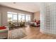 Open main bedroom with lounge chairs and beautiful views showcases the property's luxurious layout at 42145 N Fairgreen Ct, Anthem, AZ 85086