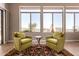 Well-lit main bedroom seating area with chairs offering views to the outside at 42145 N Fairgreen Ct, Anthem, AZ 85086
