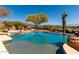 Beautiful backyard pool with desert landscaping and serene mountain views at 42145 N Fairgreen Ct, Anthem, AZ 85086