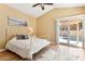 Inviting bedroom with pool access, a vaulted ceiling, and hardwood floors at 4353 E Desert Wind Dr, Phoenix, AZ 85044