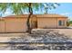 Charming single-story home with a well-maintained desert landscape and a classic tile roof at 4353 E Desert Wind Dr, Phoenix, AZ 85044