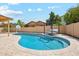 Beautiful backyard pool area with comfortable lounge, basketball hoop, and privacy fence at 4353 E Desert Wind Dr, Phoenix, AZ 85044