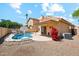 Inviting pool area with a relaxing daybed, basketball hoop, and drought resistant landscaping at 4353 E Desert Wind Dr, Phoenix, AZ 85044